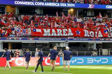 Chile fans raise several large banners before a Copa America Group A soccer match against...