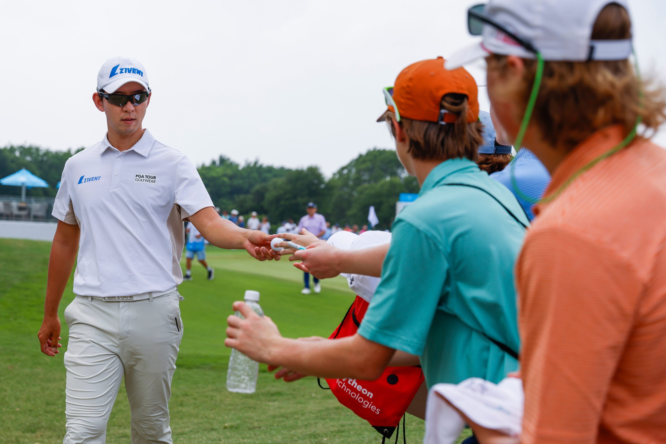 S.Y. Noh of South Korea gives a ball to a fan during the second round of the AT&T Byron...