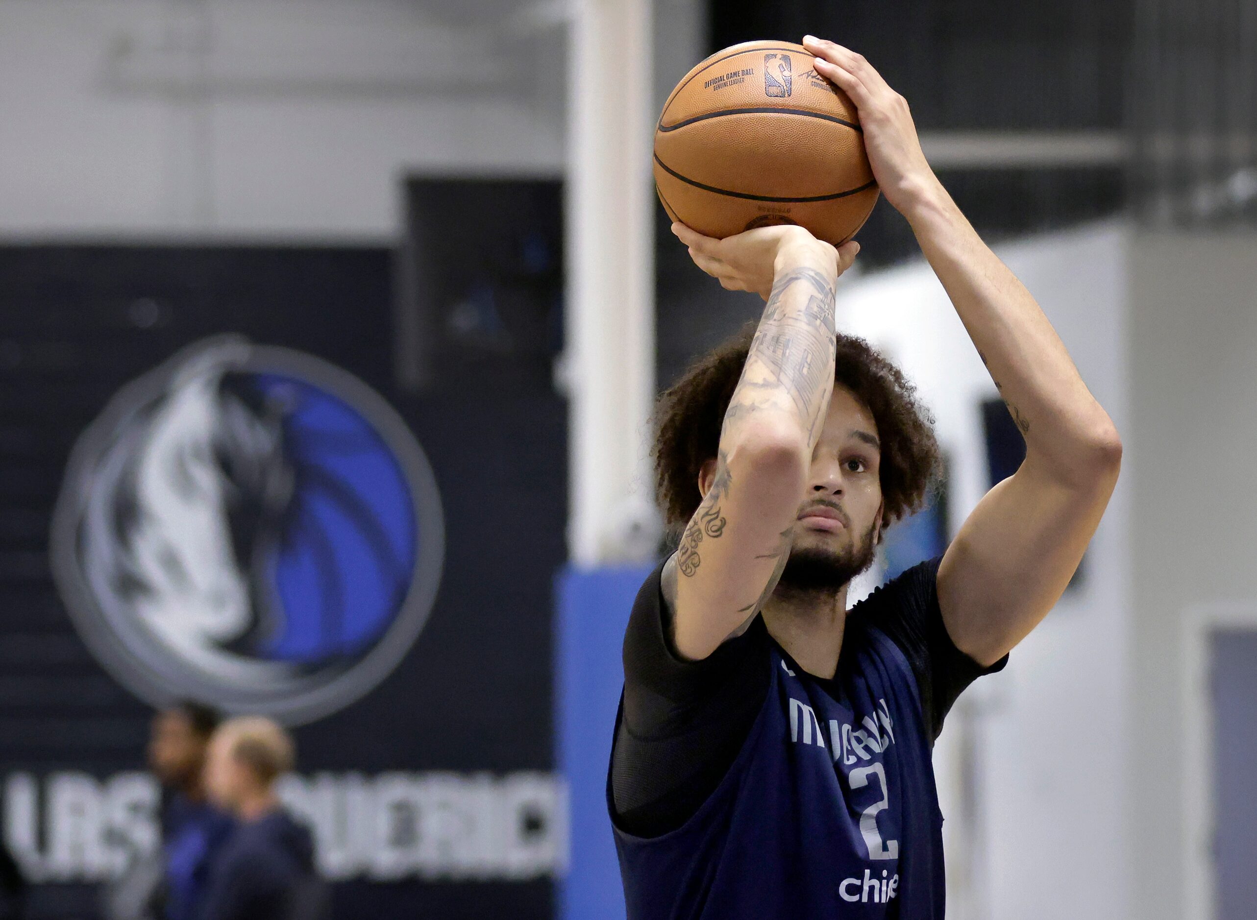 Dallas Mavericks center Dereck Lively II shoots free throws during practice at their...