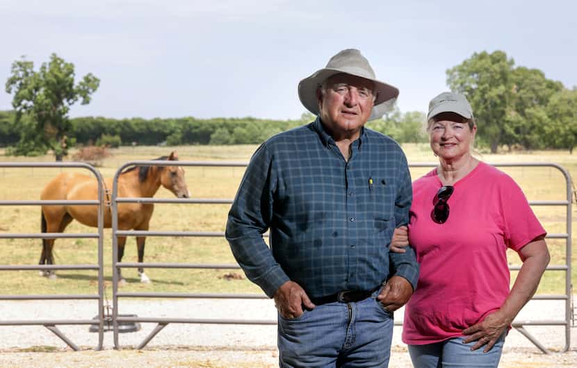 David (left) and Karen Thompson stand on their land in McKinney, where they live and care...