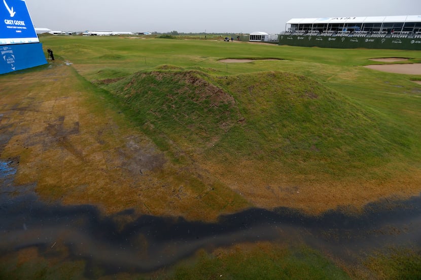 Flood water is seen on the 18th fairway during a weather delay of the final round of AT&T...