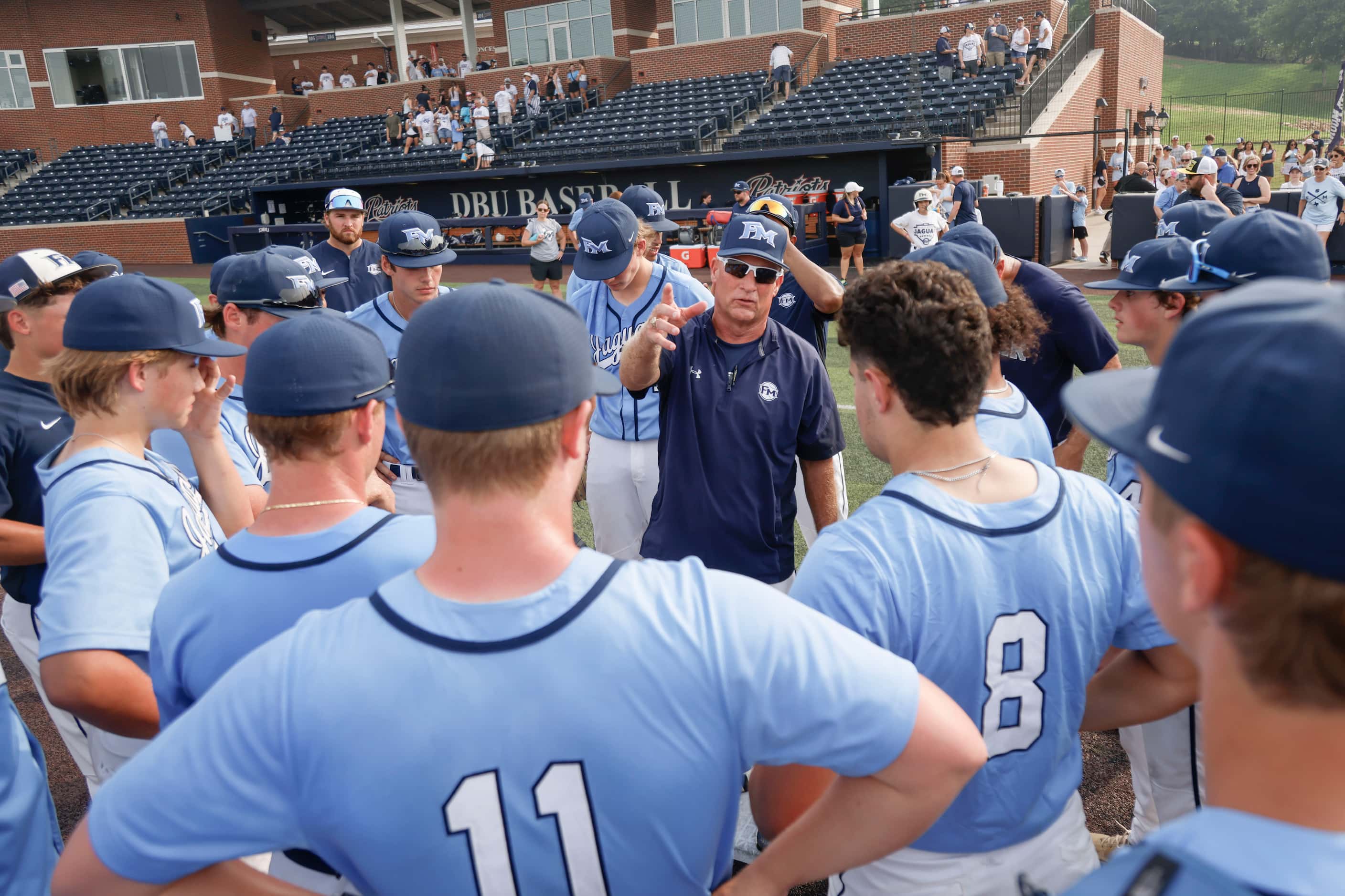 Flower Mound coach Danny Wallace speaks to players following Game 3 of a best-of-3 Class 6A...