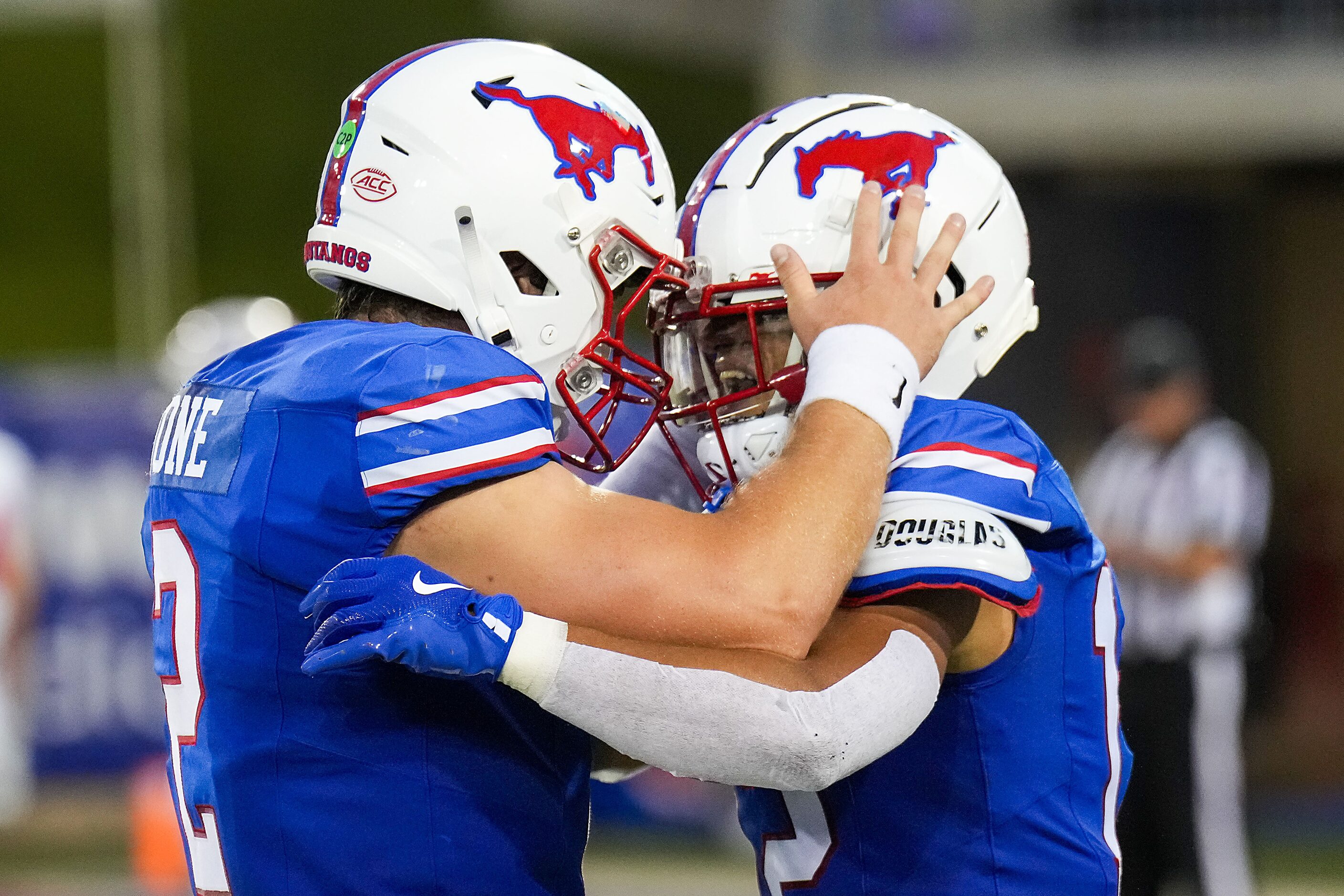 SMU quarterback Preston Stone celebrates with wide receiver Jake Bailey after they connected...