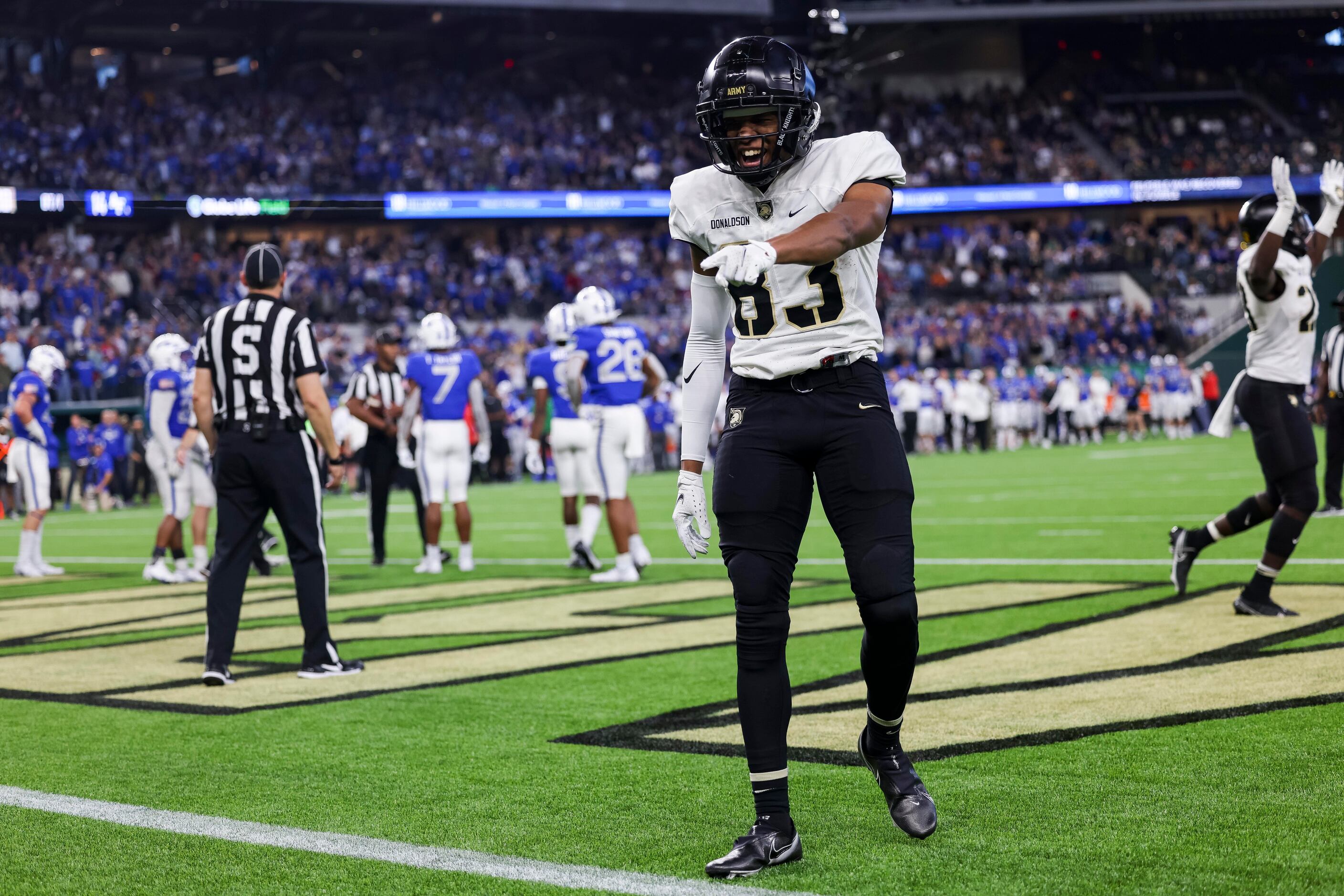 Army Black Knights wide receiver Reikan Donaldson (83) and teammates celebrate a touchdown...
