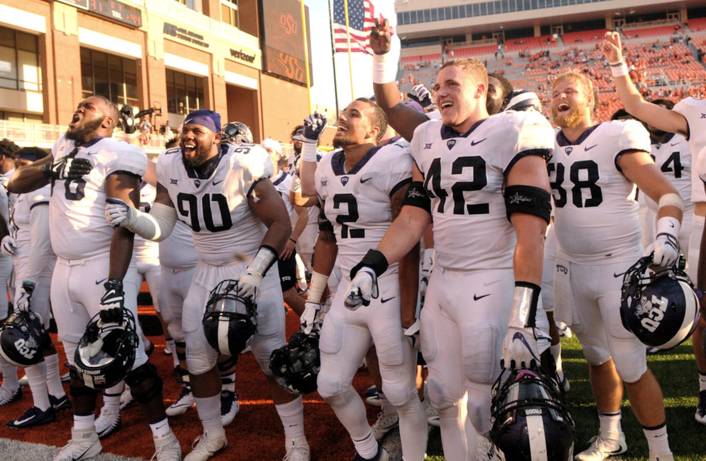 FILE - In this Sept. 23, 2017, file photo, TCU players celebrate in the end zone of Boone...