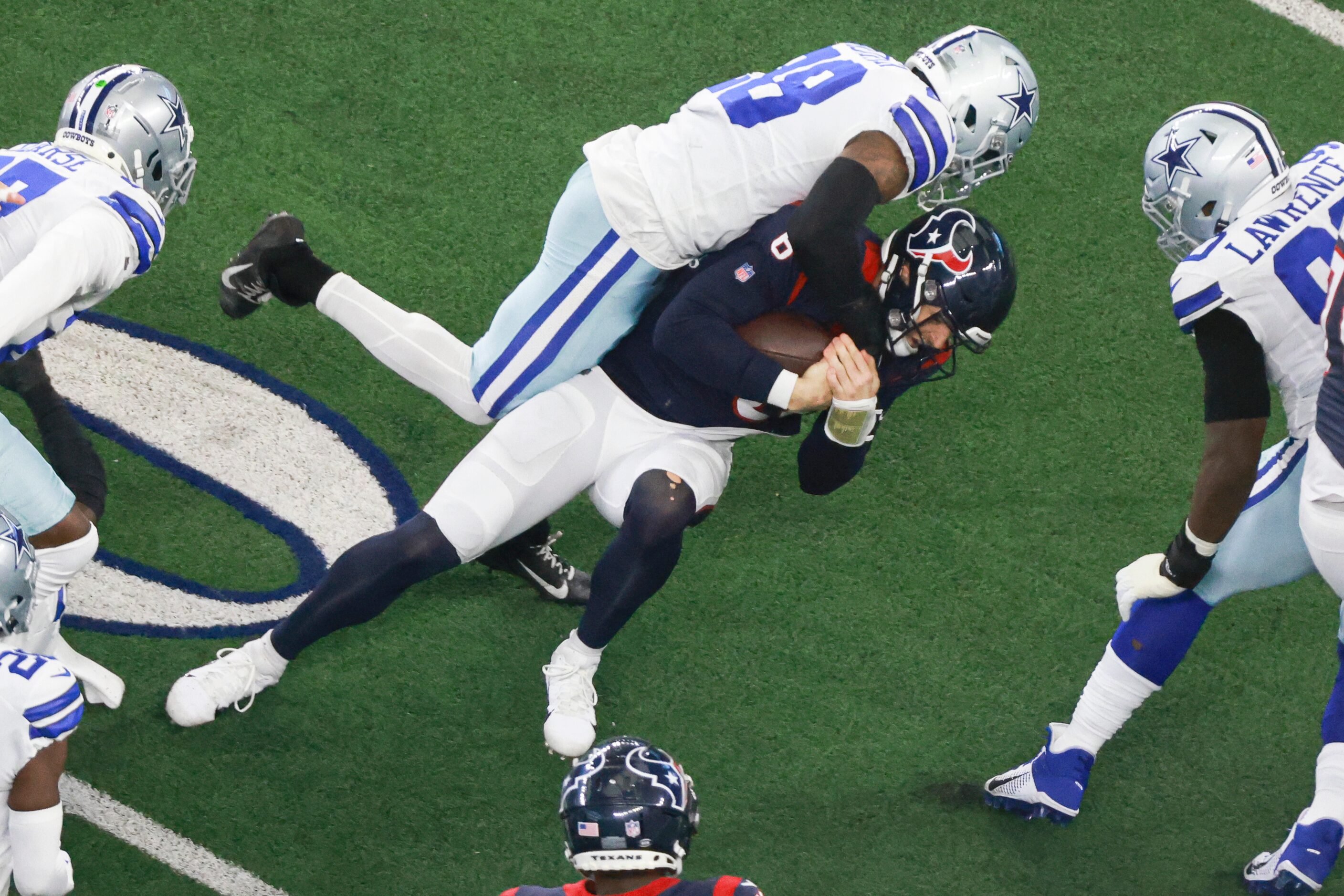 Dallas Cowboys safety Malik Hooker (28) tackles Houston Texans quarterback Jeff Driskel (6)...