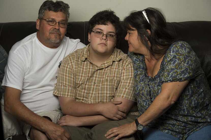 Gavin Grimm, 17, with his parents, David and Deirdre Grimm, at their home in Gloucester,...