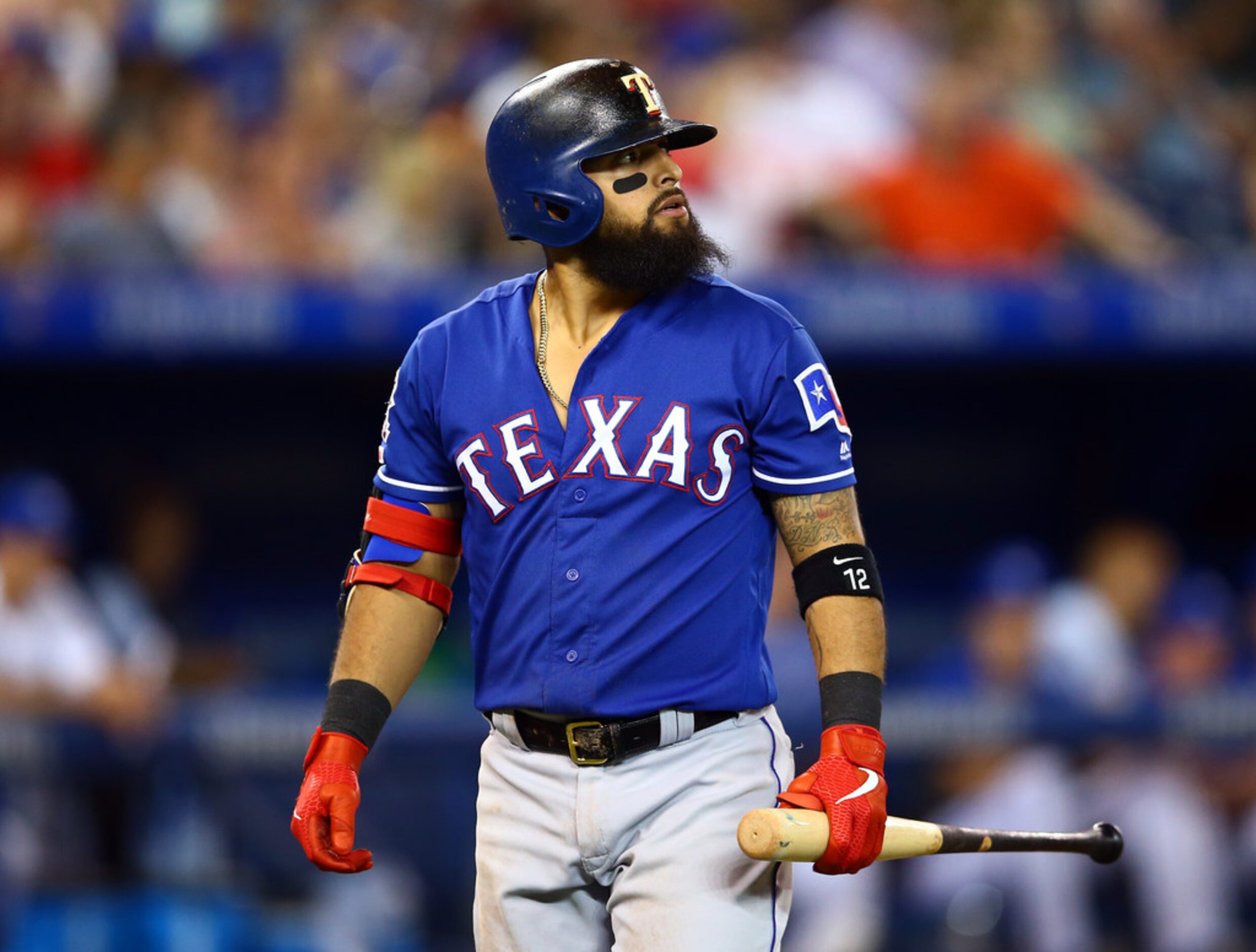 TORONTO, ON - AUGUST 13:  Rougned Odor #12 of the Texas Rangers heads back to the dugout...