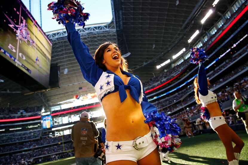 Dallas Cowboys Cheerleaders get the fans fired up in the third quarter as the team faced the...