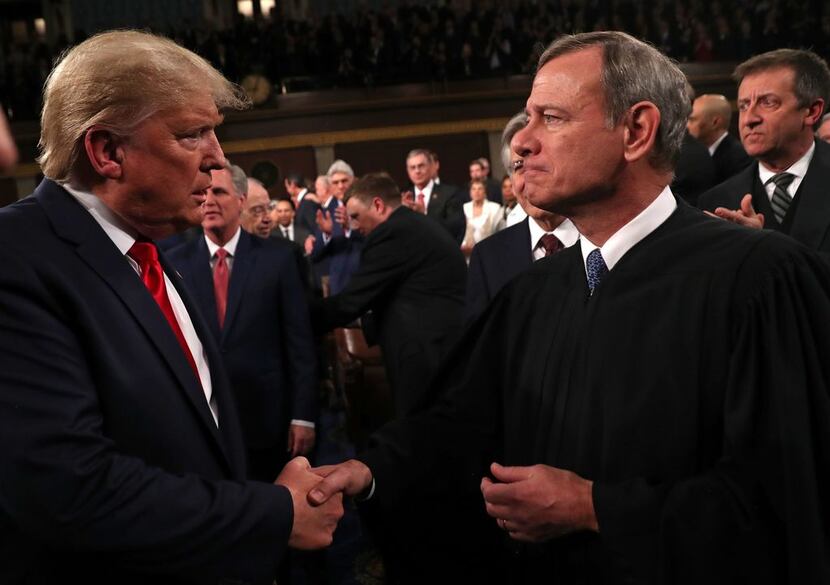 President Donald Trump greeted Chief Justice John Roberts Tuesday night before the State of...