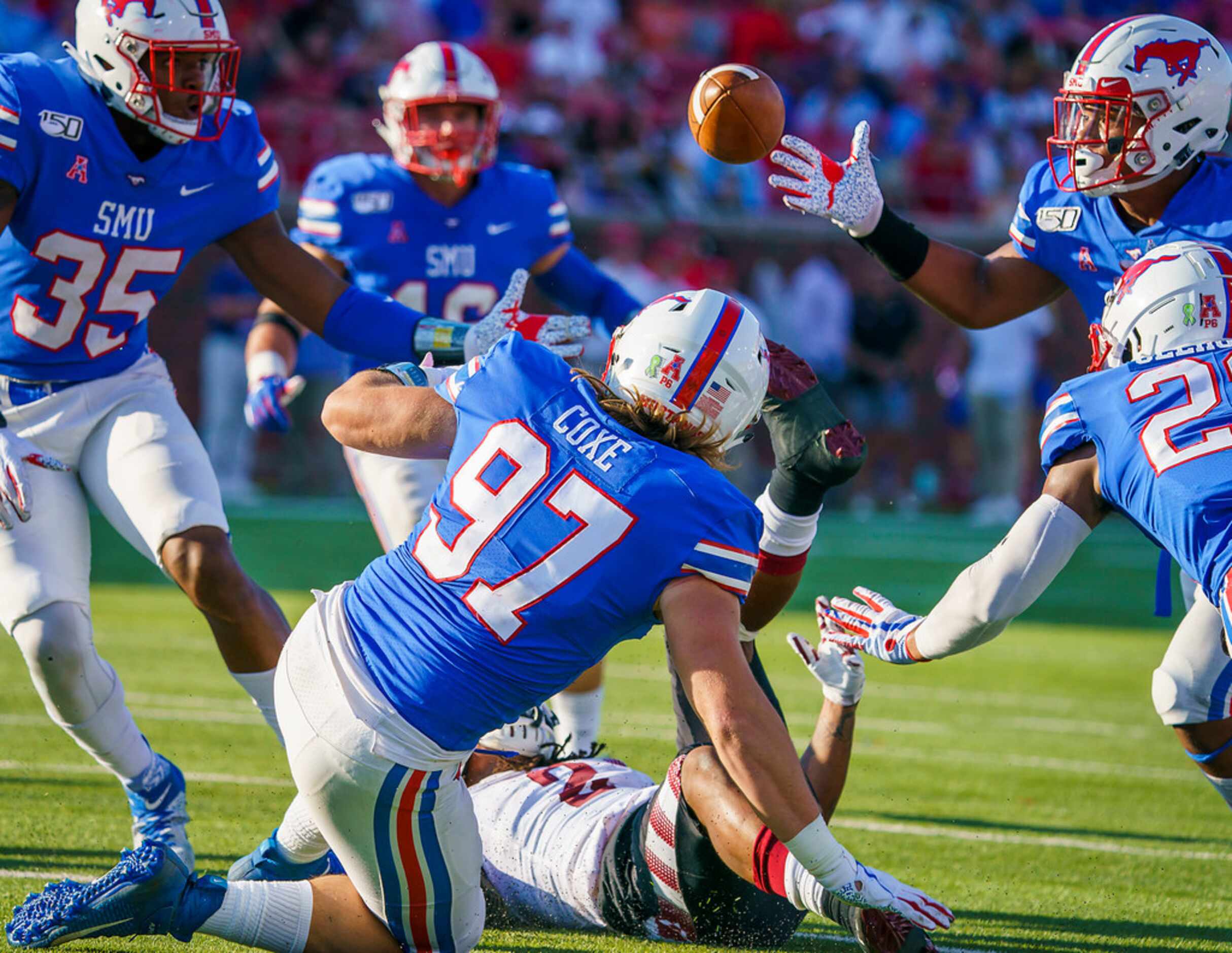 SMU safety Rodney Clemons (23) reaches to recover a fumble by Temple wide receiver Isaiah...