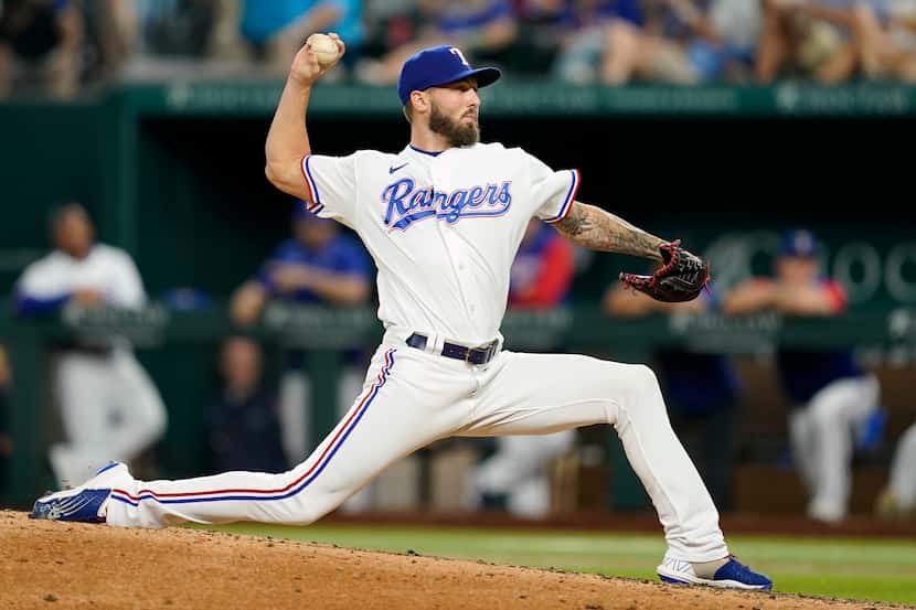 Texas Rangers relief pitcher Joe Barlow throws to the Oakland Athletics in the sixth inning...