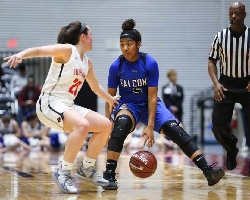 North Forney's Kyndahl Wyatt (5) works to get around Frisco Liberty's Mara Casey (20) during...