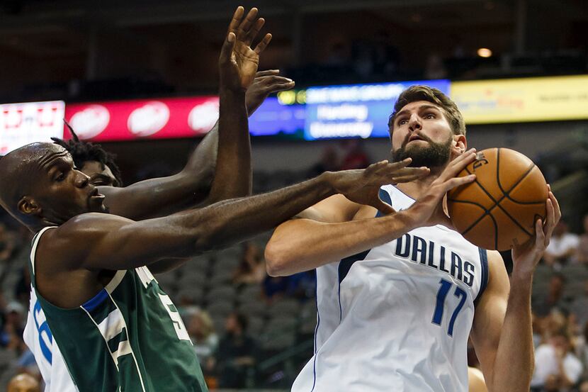 Dallas Mavericks center Jeff Withey (17) puts up a shot during the second half of an NBA...