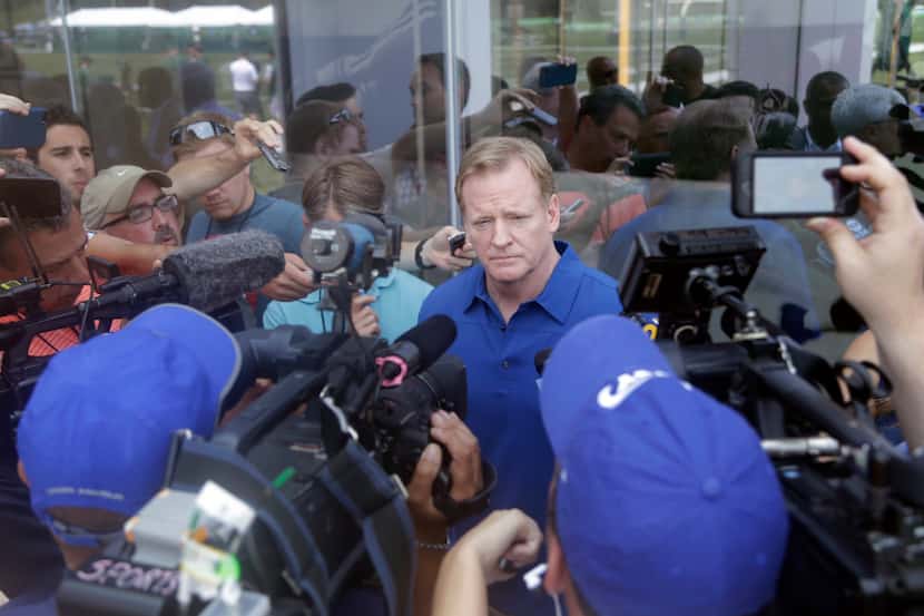 NFL commissioner Roger Goodell talks to reporters after a fan forum during a New York Jets...