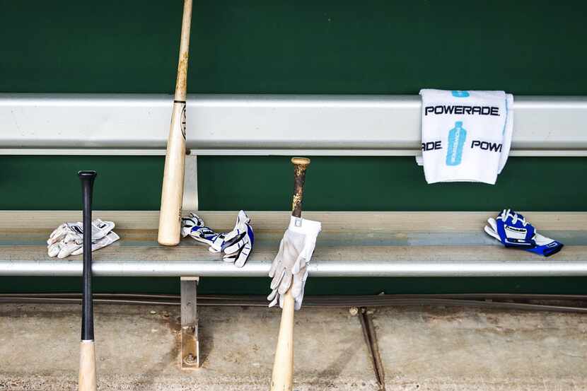Bats on the bench in the Texas Rangers dugout before a spring training game against the San...