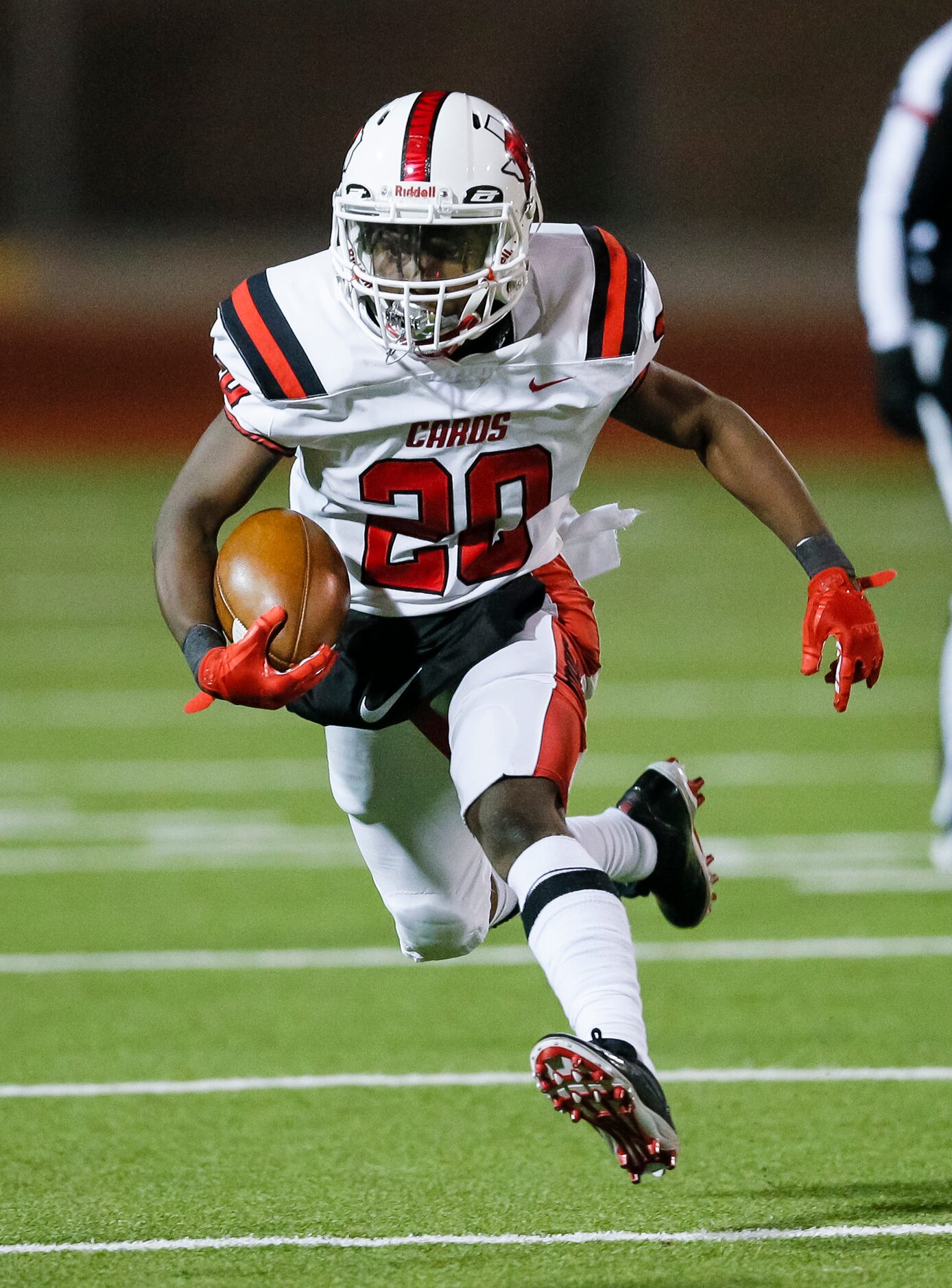 Irving MacArthur freshman Darrelle Smith (20) carries the ball during the first half of a...