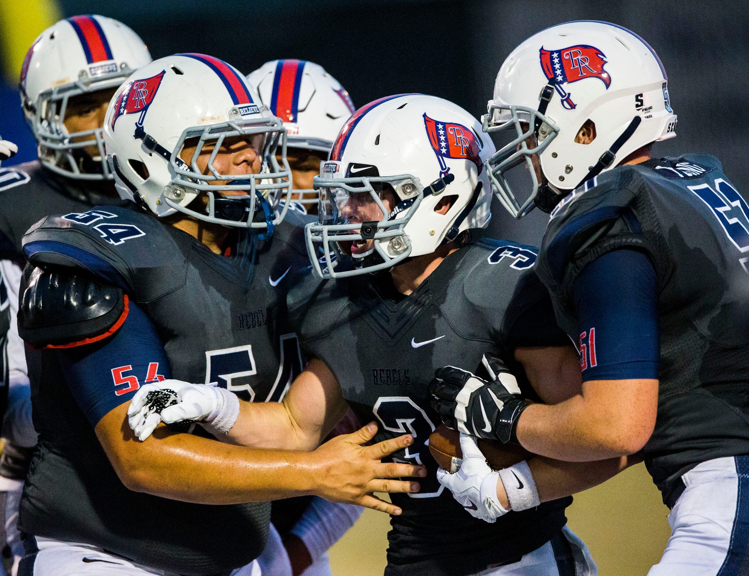 Richland High School's Colton Curtis (3) celebrates with team mates after he caught a pass...