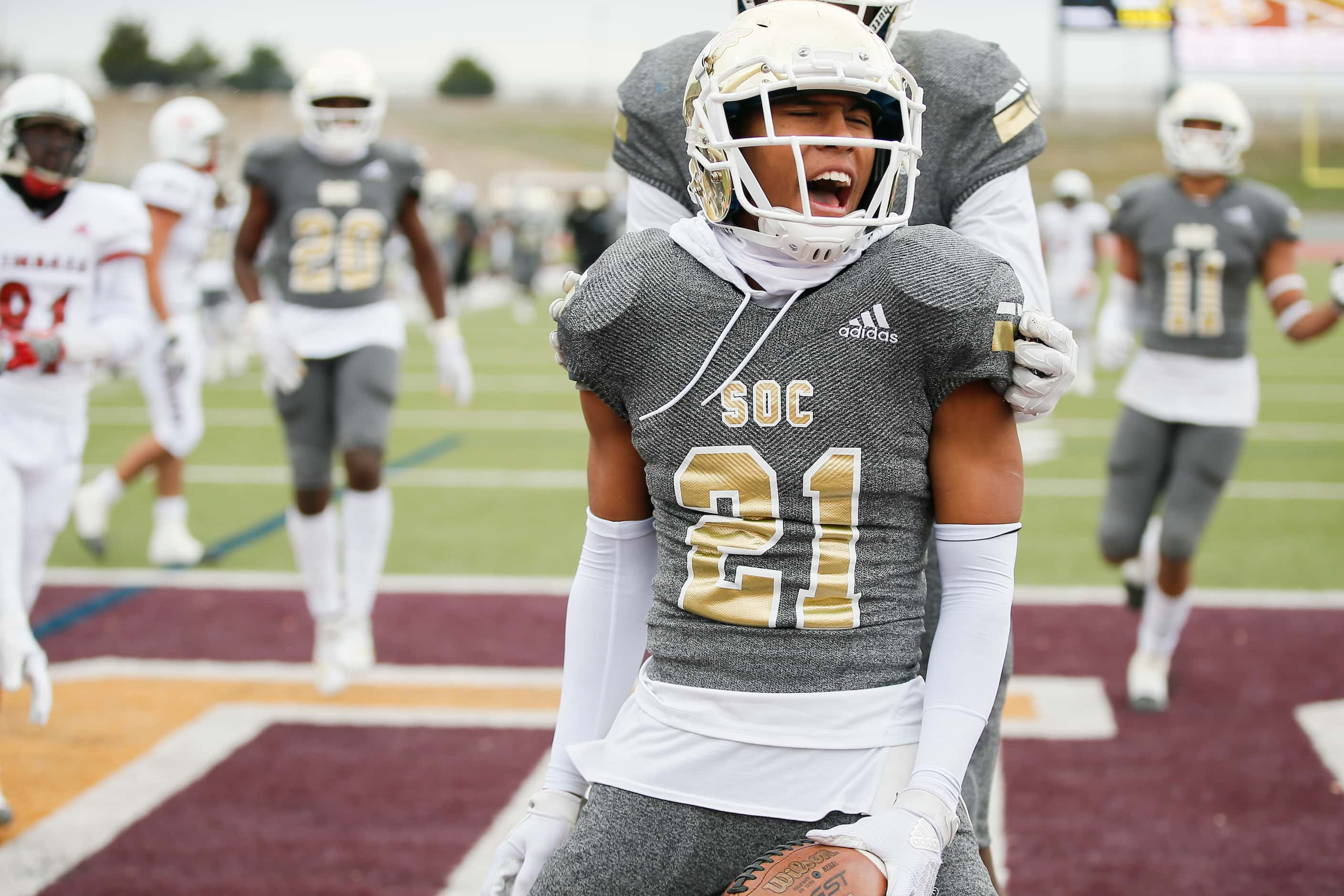 South Oak Cliff senior defensive back Jimmy Wyrick (21) celebrates after running back a punt...