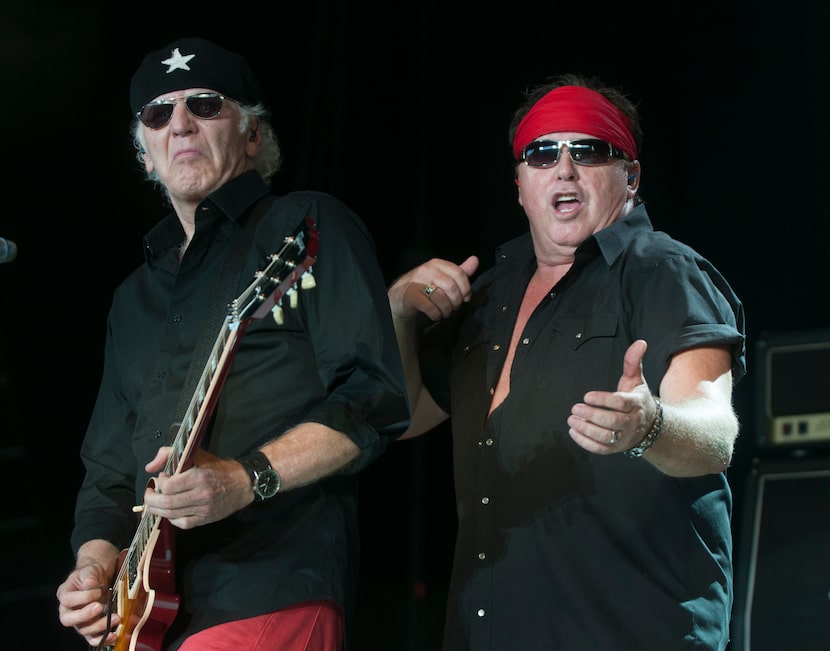 Paul Dean, left, and Mike Reno of Loverboy perform at the Gexa Energy Pavilion on Saturday,...