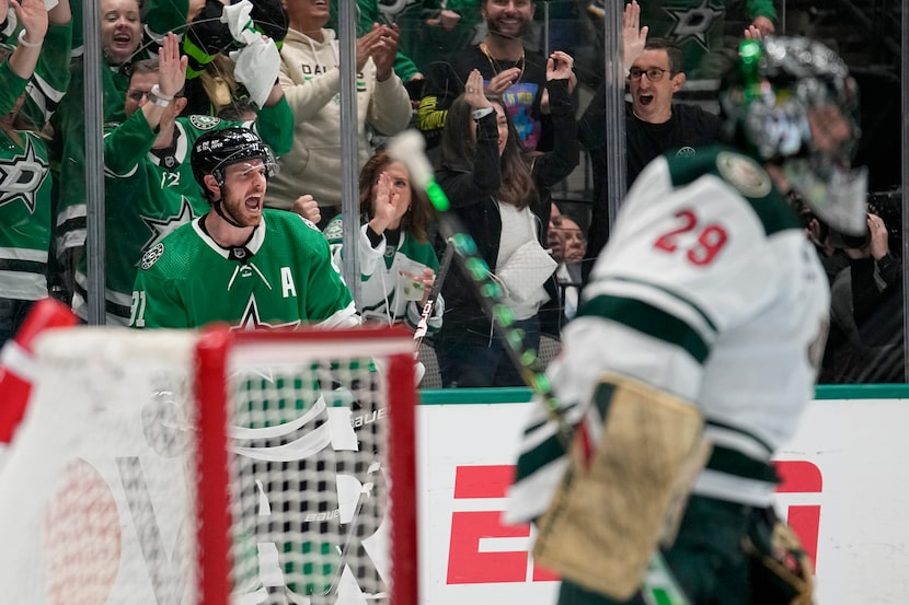 Dallas Stars center Tyler Seguin, leff rear, celebrates after scoring against Minnesota Wild...