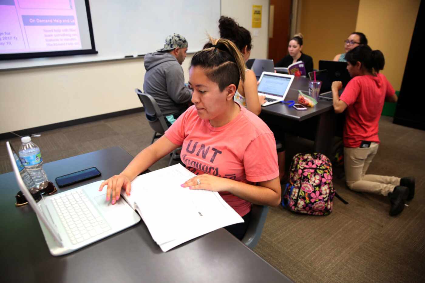 Karina Escalante, a student in UNT Dallas' School of Education, works on a group project...