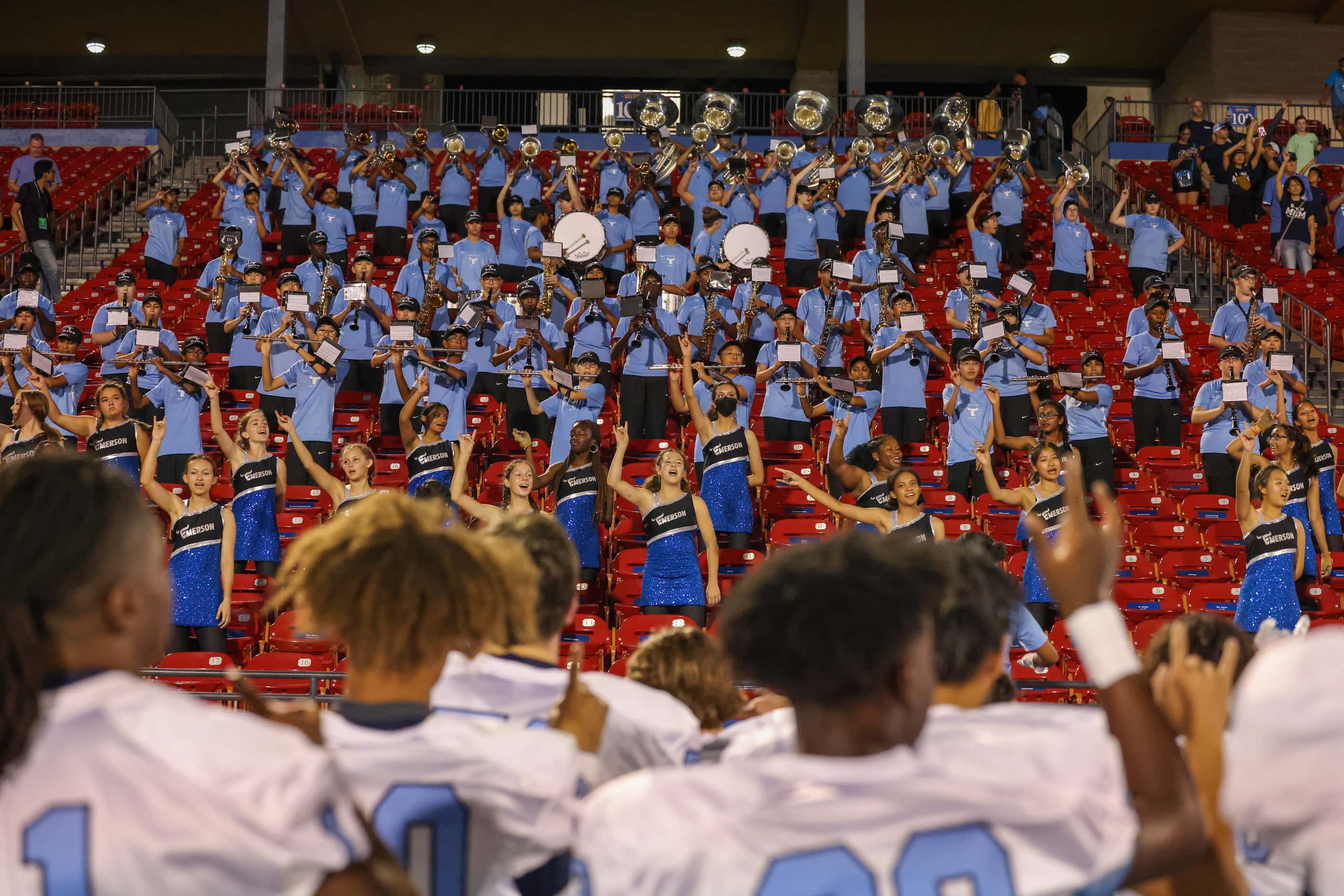 Emerson Mavericks join in on their school song after winning a game against the Panther...