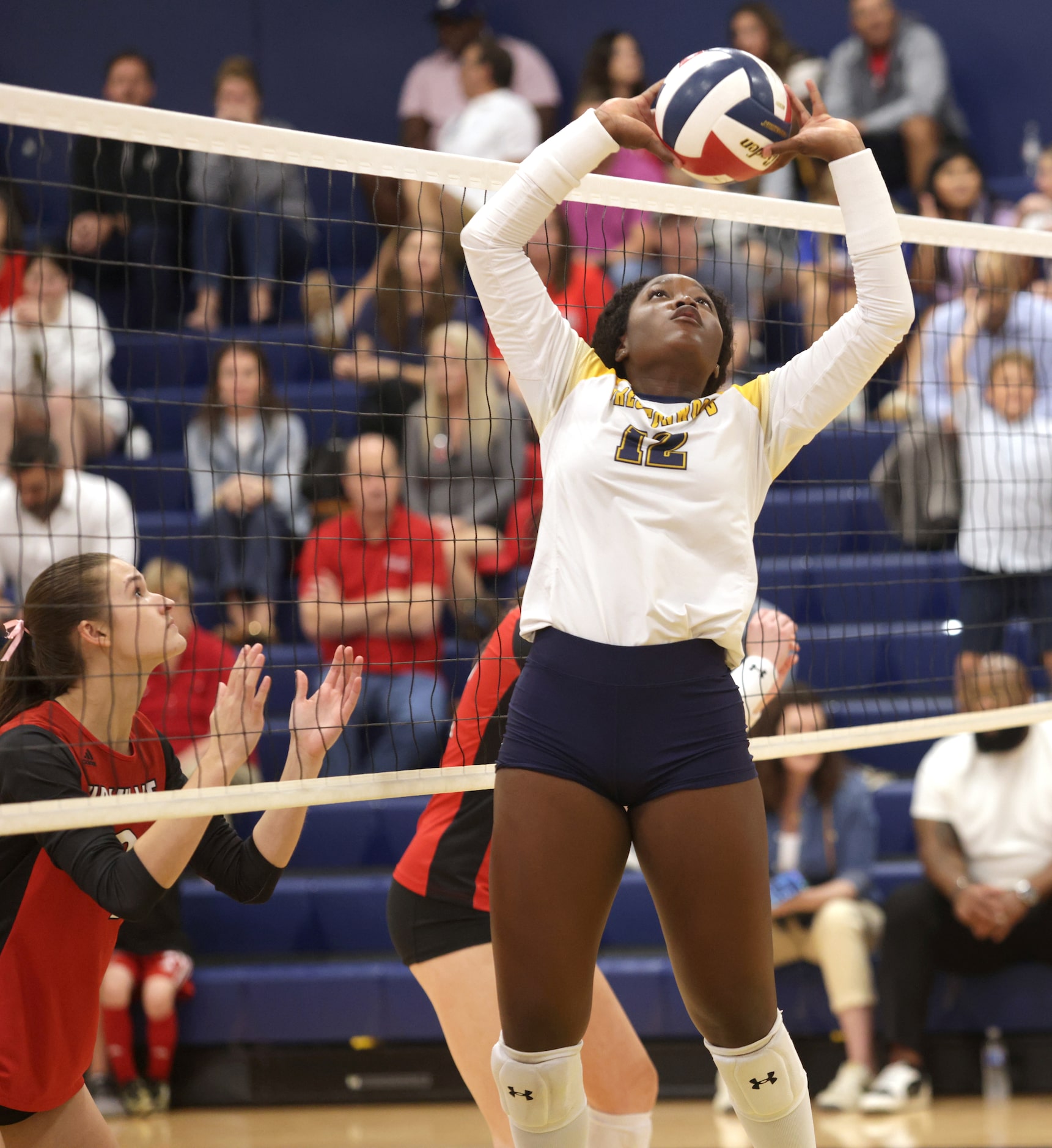 Prestonwood player #12 Taylor Cook sets the ball during the Ursuline Academy of Dallas...