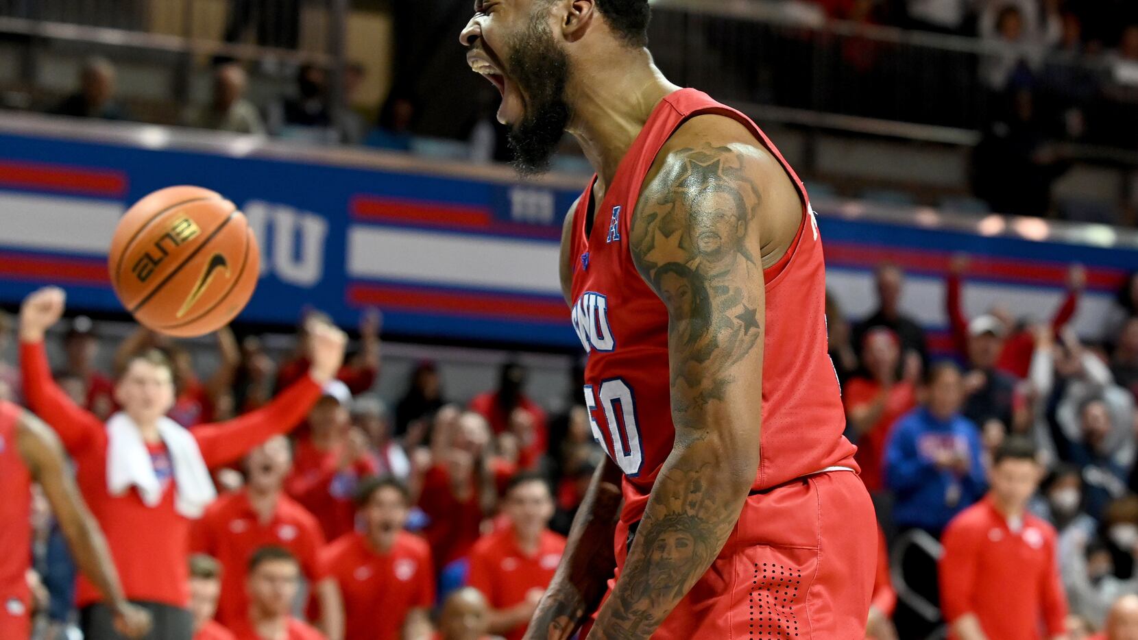 SMU forward Marcus Weathers (50) celebrate after a dunk in the second half during a men’s...