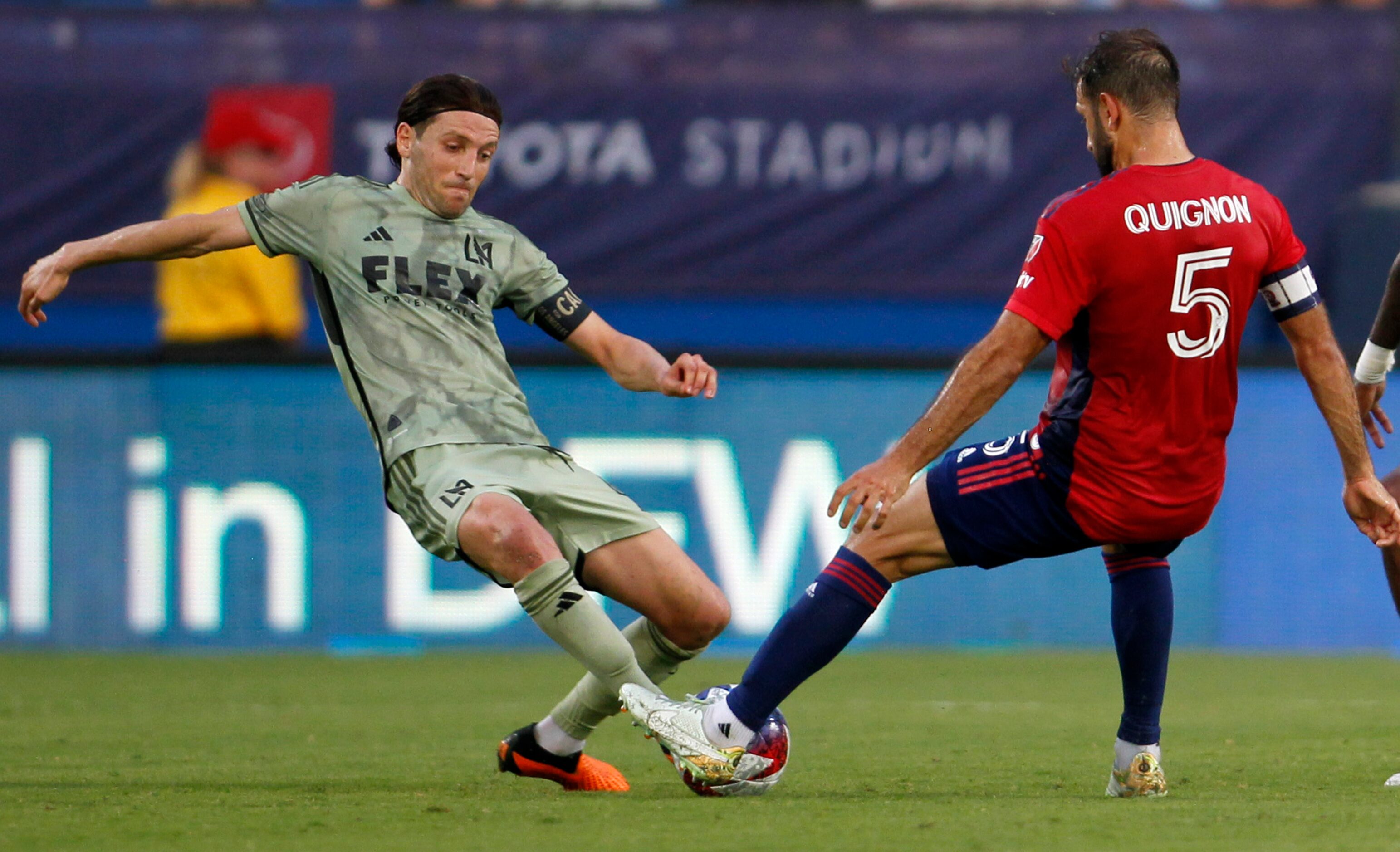 FC Dallas midfielder Fancundo Quignon (5), right, challenges LA FC midfielder Ilie Sanchez...