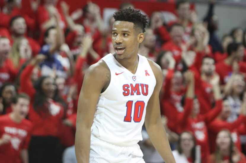 SMU Mustangs guard Jarrey Foster (10) ignites the home crowd after his uncontested dunk...