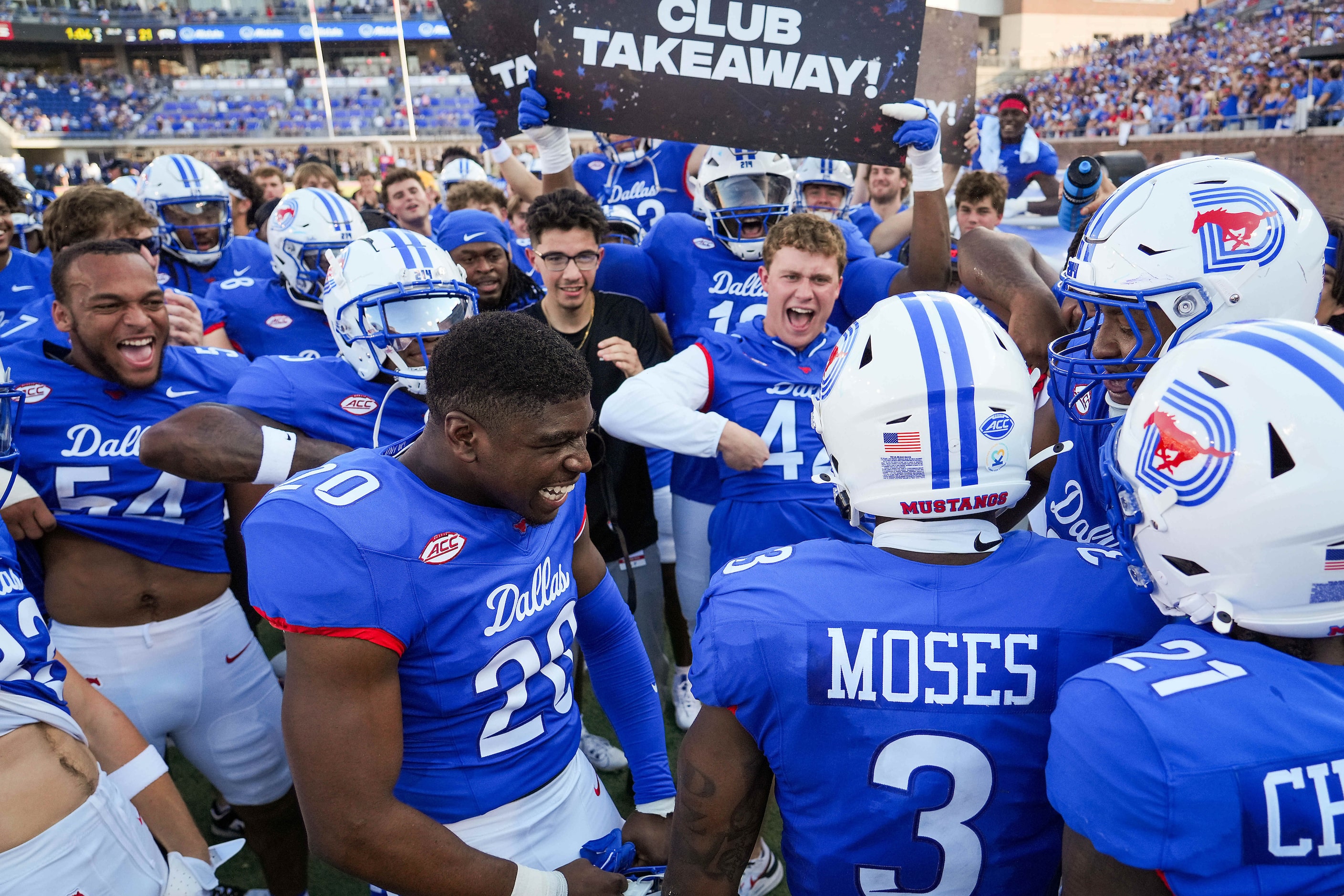 SMU safety Ahmaad Moses (3) celebrates with teammates as he returns to the bench after...