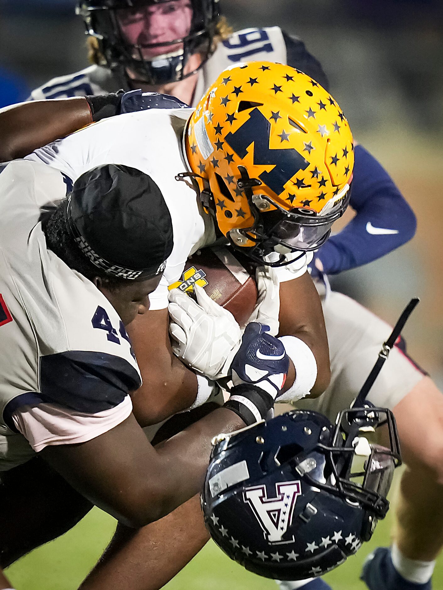 Allen defensive lineman Timothy Brantley (44) loses his helmet as he brings down McKinney...