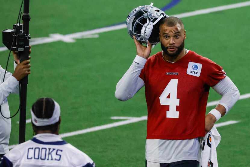 Dallas Cowboys quarterback Dak Prescott (right) talks to wide receiver Brandin Cooks During...