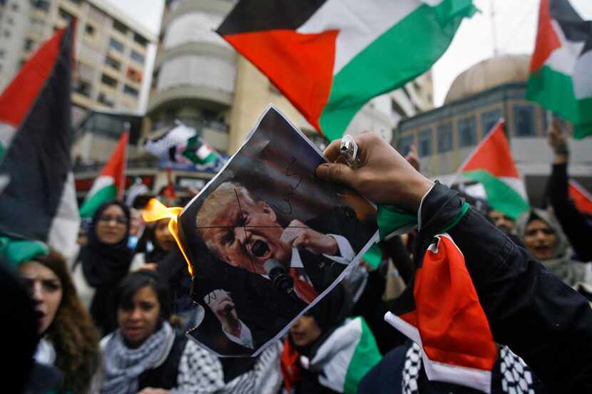 Lebanese and Palestinians students burned a picture President Donald Trump during a protest...