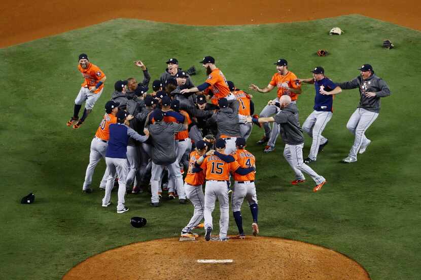 The Houston Astros celebrate defeating the Los Angeles Dodgers 5-1 in game seven to win the...