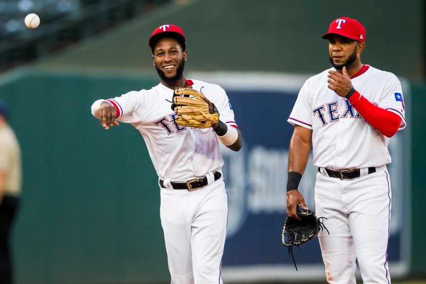 Texas Rangers shortstop Jurickson Profar (19) and shortstop Elvis Andrus (1) warm up before...