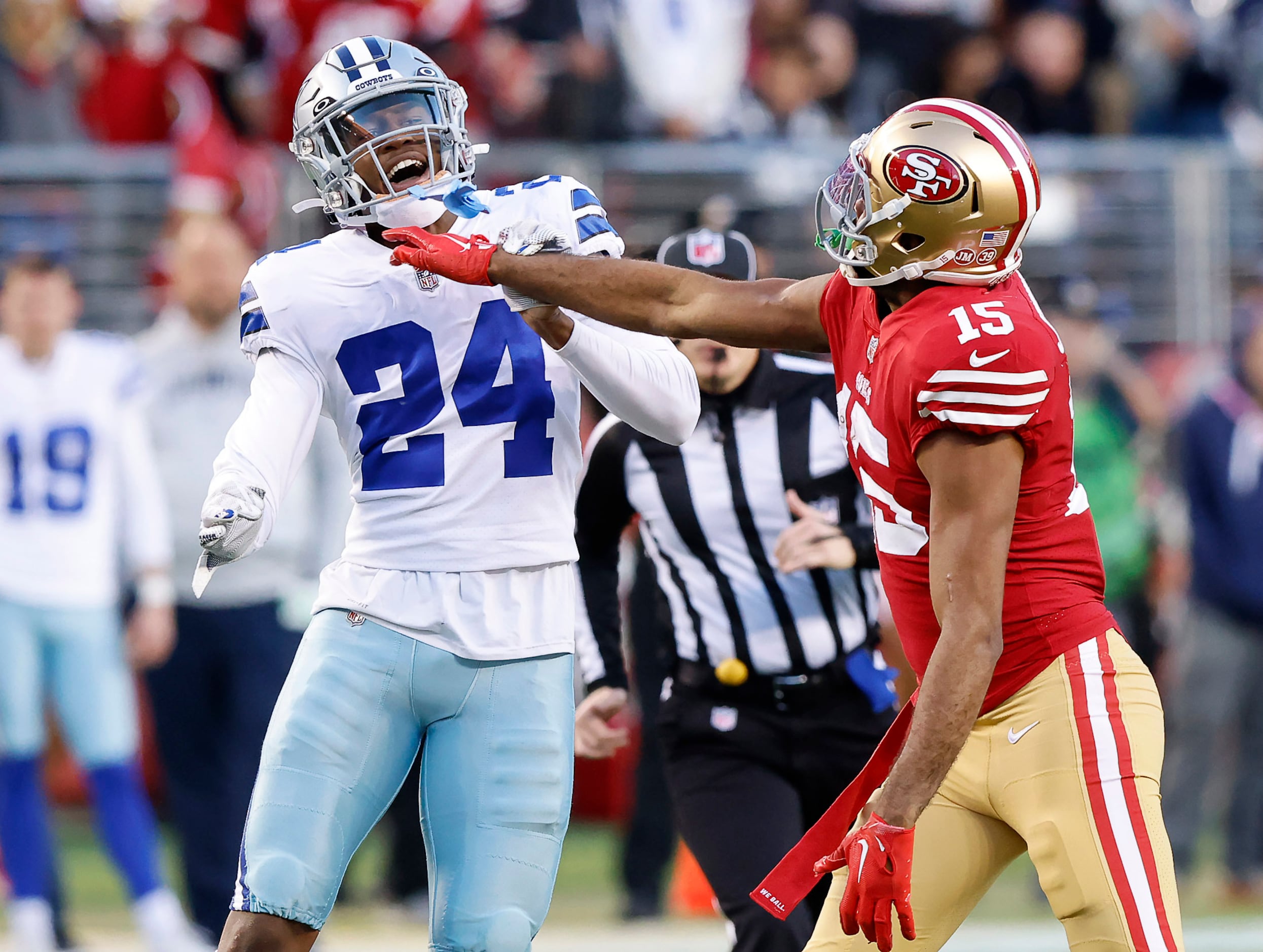 Santa Clara, United States. 22nd Jan, 2023. San Francisco 49ers wide  receiver Jauan Jennings (15) tries to fend off Dallas Cowboys defensive end  DeMarcus Lawrence (90) in the NFC Divisional Playoffs at