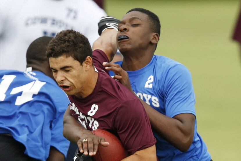 Matthew Munoz (8) of Trinity High School is tagged by Michael Clemons (2) of Sachse High...