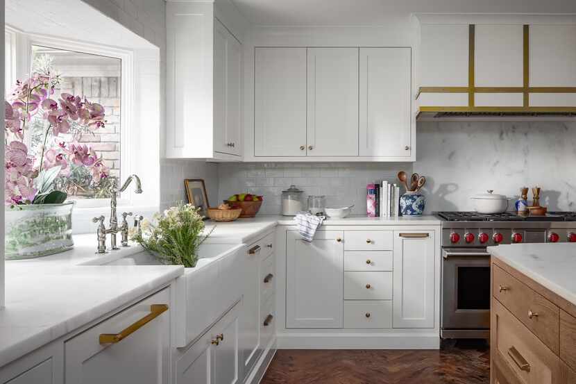Designer Angeline Guido Hall designed this kitchen with complimenting backsplashes utilizing...