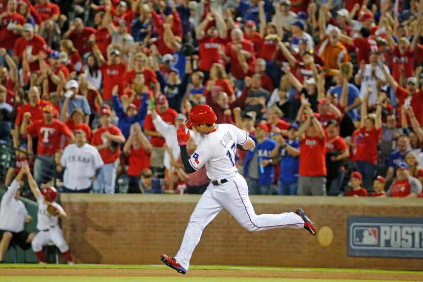 Texas Rangers right fielder Shin-Soo Choo (17) rounds the bases after hitting a solo homer...