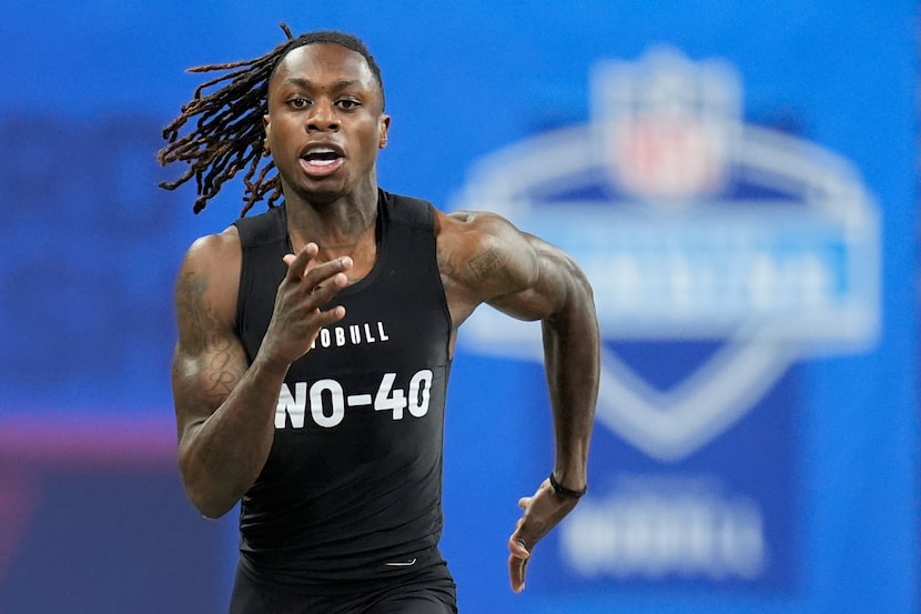 Texas wide receiver Xavier Worthy runs a drill at the NFL football scouting combine,...