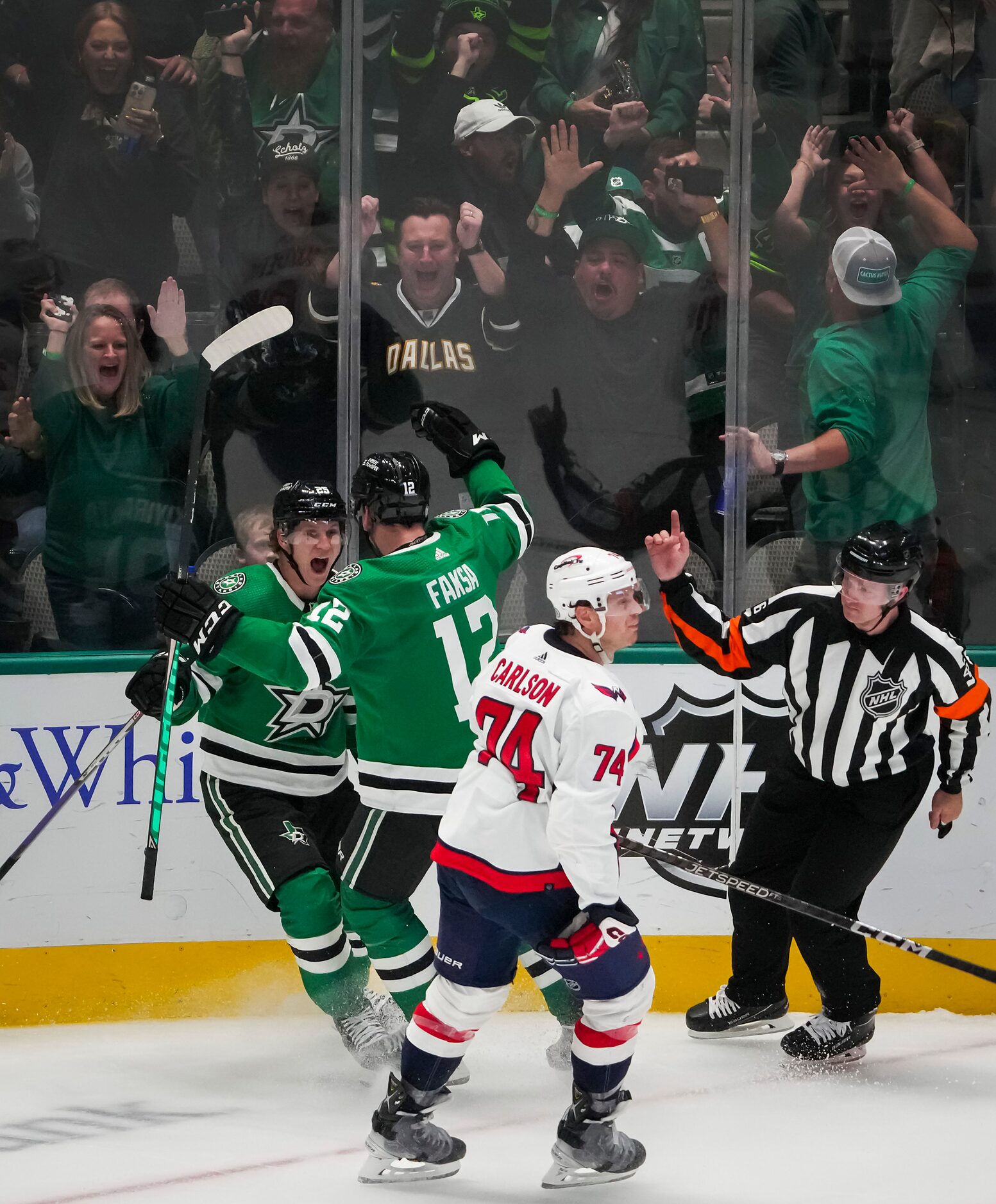 Dallas Stars left wing Joel Kiviranta (left) celebrates with center Radek Faksa after...