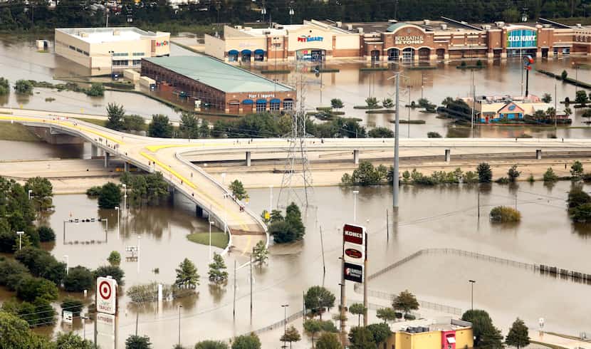 A shopping center along Interstate 69 is flooded by rainwater left from Hurricane Harvey in...
