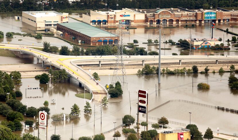 A shopping center along Interstate 69 is flooded by rainwater left from Hurricane Harvey in...