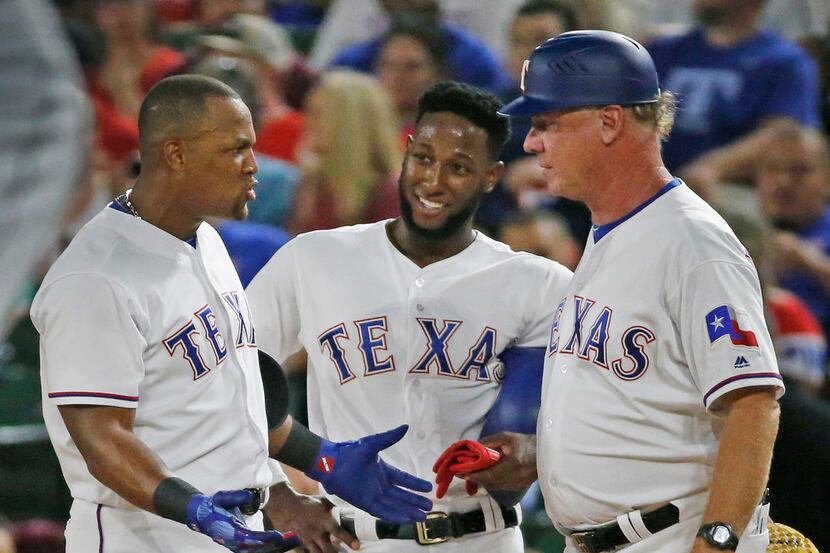 Texas Rangers designated hitter Adrian Beltre (29) talks with Jurickson Profar (19) and...
