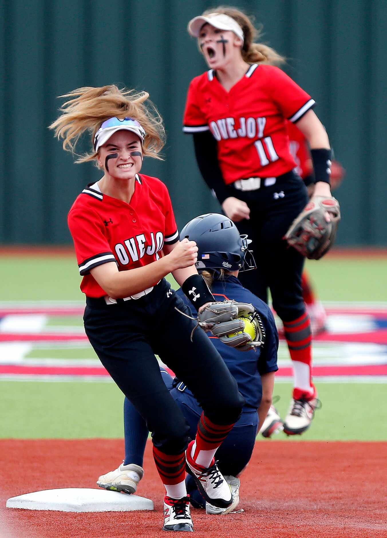 Lovejoy second baseman Hannagh Harvey (11) and shortstop Skylar Rucker (5) react to picking...