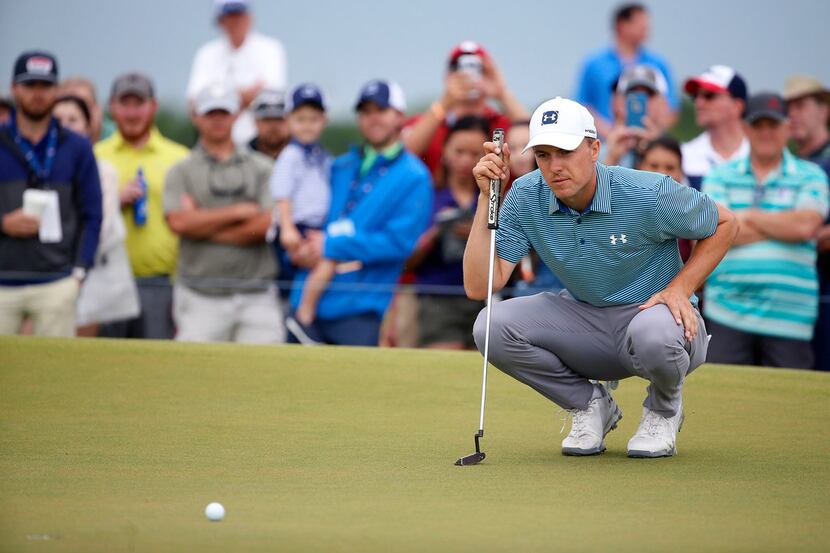 Jordan Spieth lines up a putt on the second green during the final round of AT&T Byron...