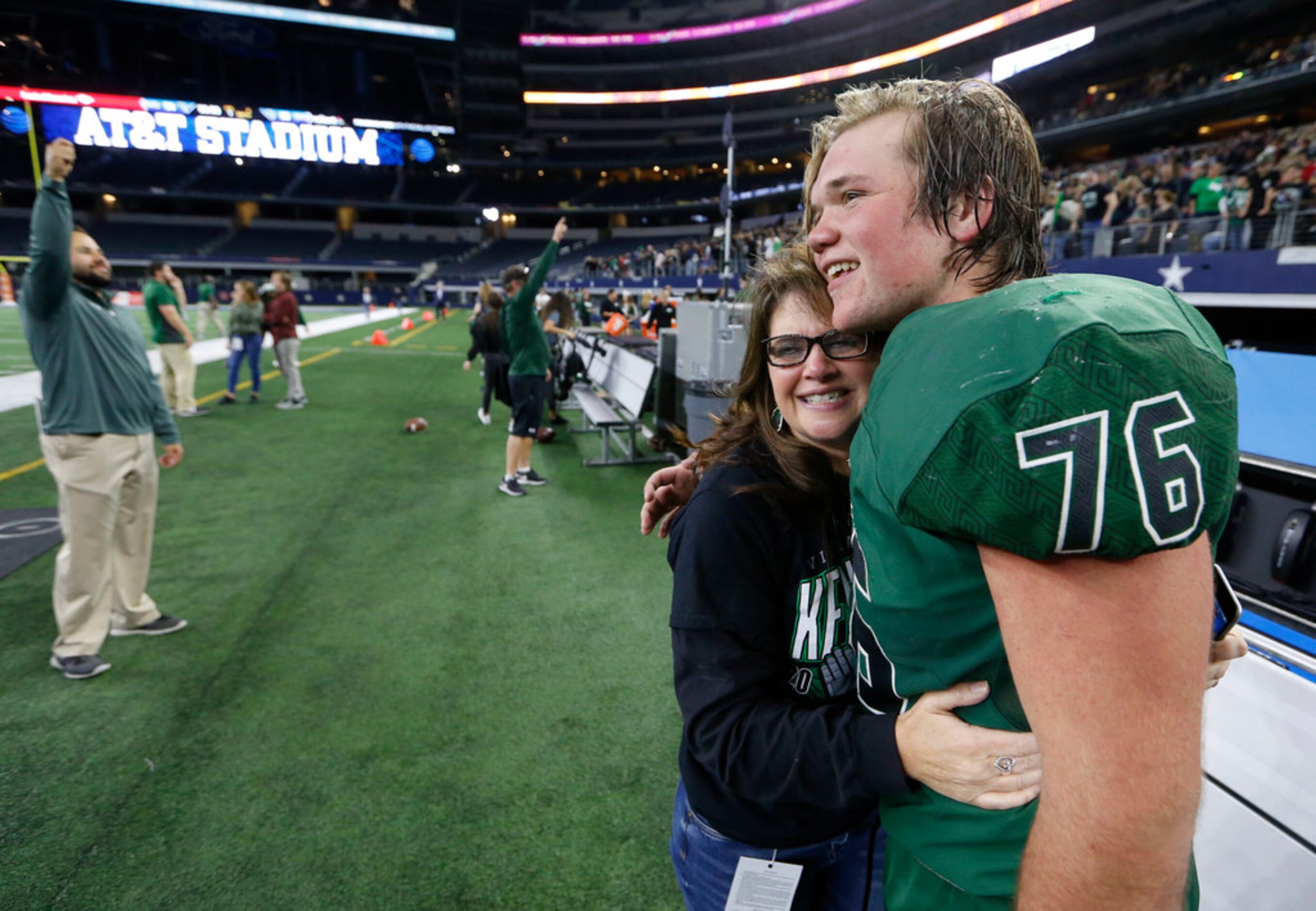 Kennedale's Brett Bostad (76) gets a hug from his mother Patti Bostad after defeating...