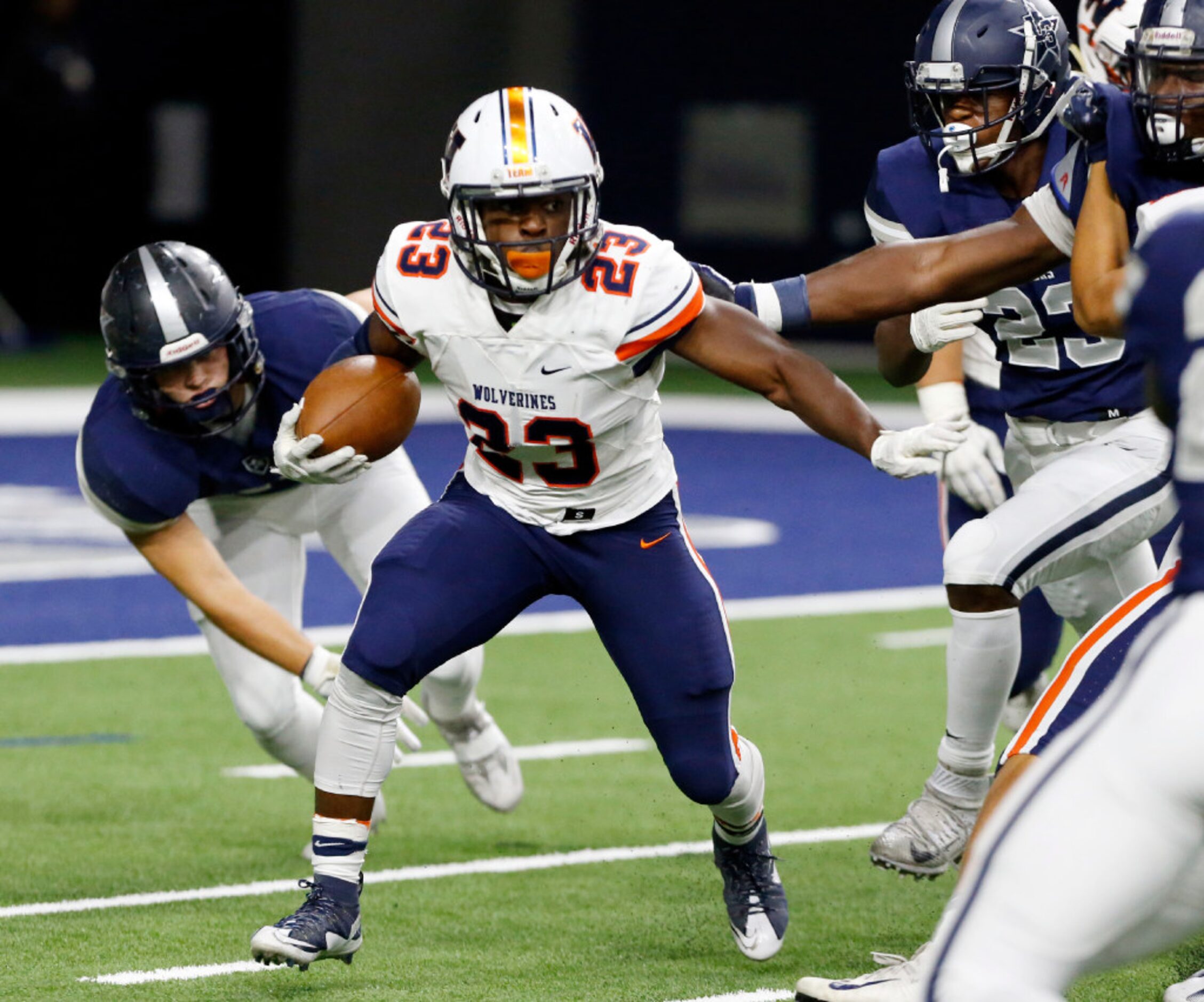 Frisco Lone Star High defenders box in Frisco Wakeland High RB Jay Orji (23) during the...